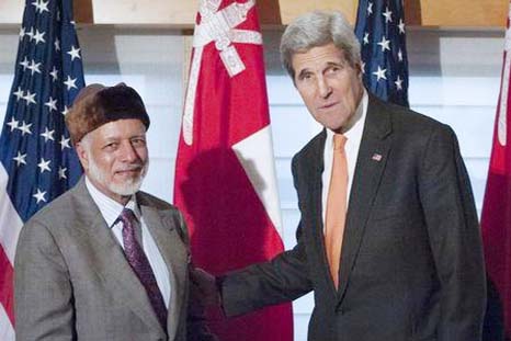 United States Secretary of State John Kerry (R) shakes hands with Foreign Minister Yusuf bin Alawi bin Abdullah of Oman as they pose for photos at the Palace Hotel in New York.