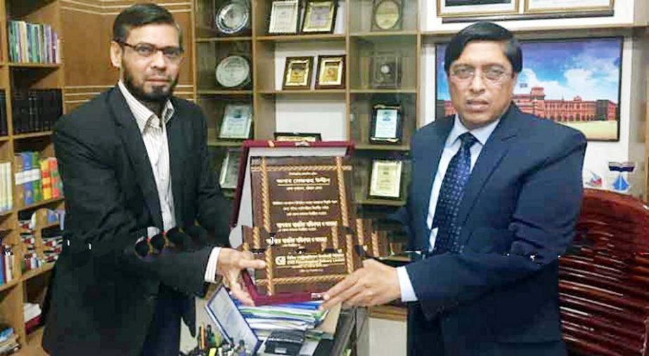 CVO Petrochemical Refinery Limited DMD Nizamuddin Mahmud Hossain giving a crest to DC Mejbauddin Ahmed in a ceremony recently.