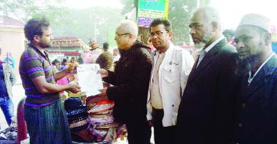 NARAYANGANJ: A T M Kamal, General Secretary, Narayanganj City BNP taking with a shopkeeper during election campaign for BNP's candidate on Monday.