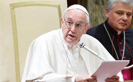 Pope Francis addresses the Roman Curia, the Church's governing body, during a meeting at the Vatican on Monday.