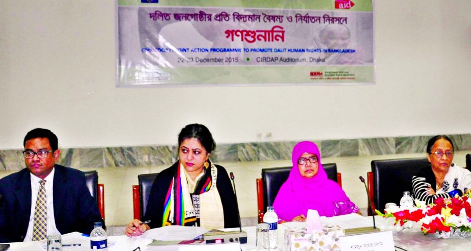 Senior District Judge Shamsunnahar Begum along with other distinguished persons at a mass hearing on 'Existing disparity on Dalit people' organized by different organisations at CIRDAP auditorium in the city on Tuesday.