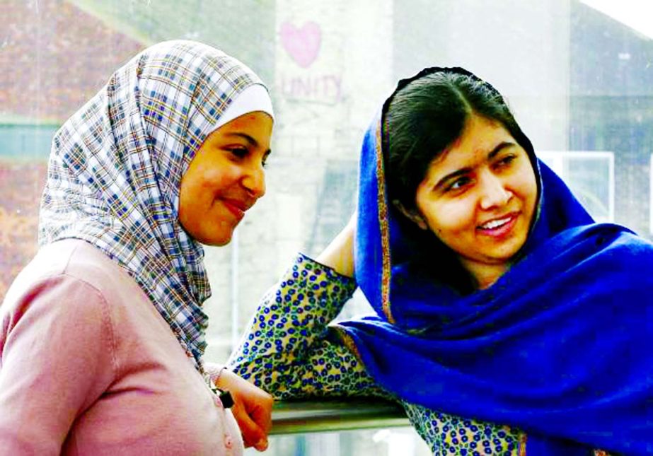 Malala Yousefzai and 17 years old Syrian refugee Muzoon Almellehan speak at the City Library in Newcastle Upon Tyne, Britain on Tuesday.