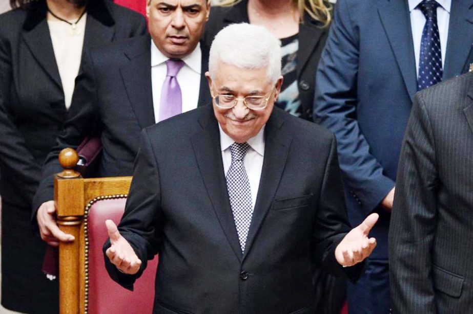 Palestinian President Mahmoud Abbas acknowledges applause by Greek lawmakers during a parliamentary session in Athens, on Tuesday.