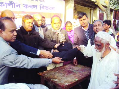 RANGPUR: Dr Swapon Kumar Pal, Deputy Director of Animal Husbandry Directorate distributing blankets among poor people at Gangachara Upazila organised by Animal Health Companies Association of Bangladesh on Tuesday.