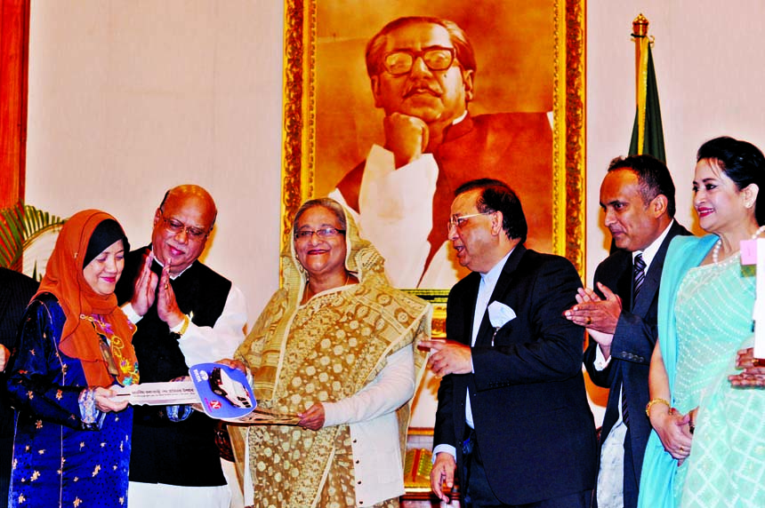 Prime Minister Sheikh Hasina handing over keys of 10 ambulances given by Nitol-Tata to the authorities of different hospitals at Ganabhaban in the city on Thursday. BSS photo