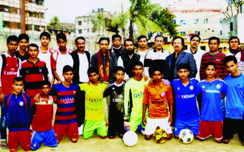 The participants of long-term football coaching programme pose for a photo session at the Dholaipar High School Ground in the city recently. Instructors of Monsur Sporting Club are conducting the coaching programme.