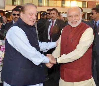 Pakistani Prime Minister Nawaz Sharif (L) shakes hands with his Indian counterpart Narendra Modi after his arrival in Lahore, Pakistan on Friday.