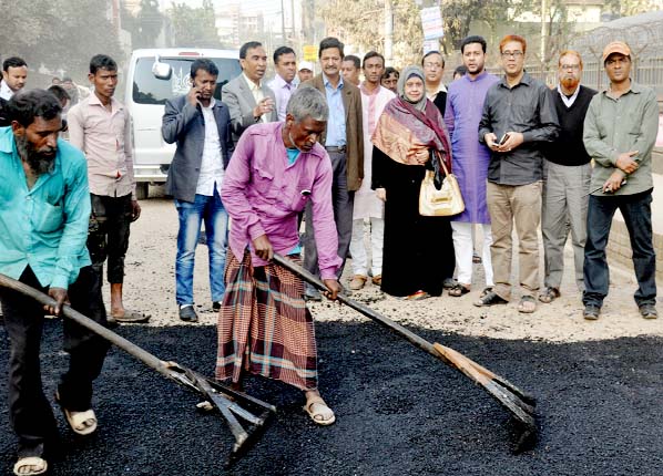 CCC Acting Mayor Mrs Jobaida Nargis Khan visiting carpeting work of the B Block of the main road of Chandgaon Residential area in the city yesterday.