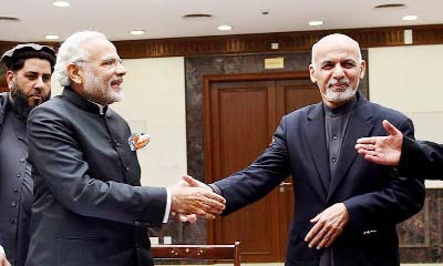 Indian Prime Minister Narendra Modi (L) shakes hands with Afghan president Ashraf Ghani during the inauguration of the new parliament complex in Kabul on Friday.
