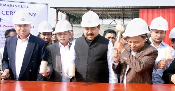 Shipping Minister Shajahan Khan inaugurating work of a 3-story modern ship having capacity of 700 passengers at Nayanagar in Gazaria Upazila under Munshiganj on Saturday. The ship is being built by Three Angle Marine Ltd at its own shipyard which will ply