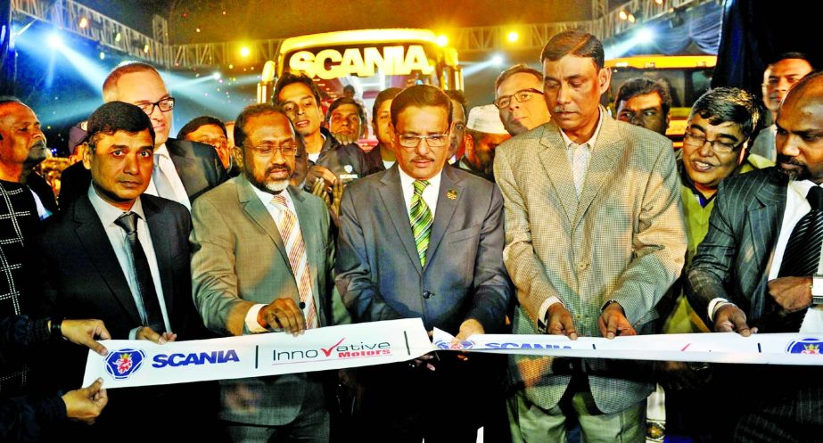 Obaidul Quader, Minister for Road Transport and Bridges, inaugurating SCANIA Vehicles at the Bangabandhu International Convention Centre (BICC) in the capital on Sunday. Aslamul Haque, MP, Johan Frisell, Ambassador of Sweden to Bangladesh, Md Faruk Talukd
