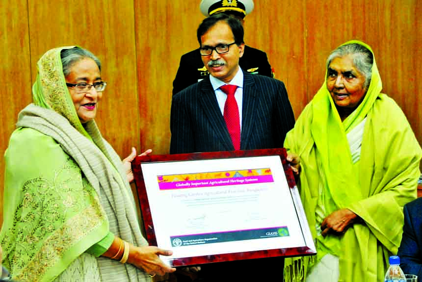 Agriculture Minister Begum Matia Chowdhury handing over certificate of UN prize to Prime Minister Sheikh Hasina at the Cabinet meeting in the Secretariat on Monday for the development in agriculture sector. BSS photo