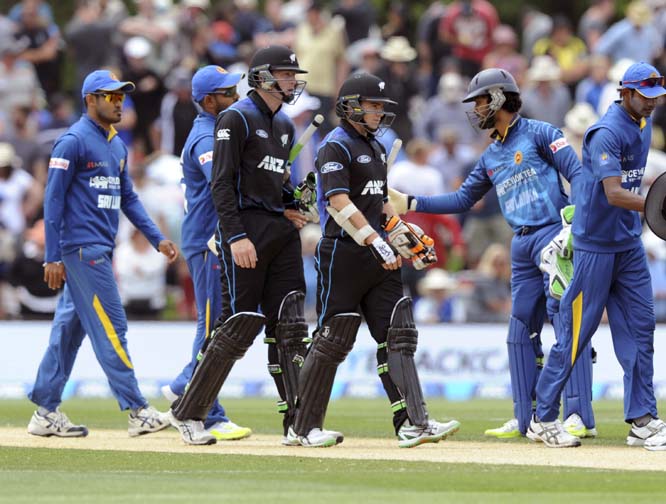 New Zealandâ€™s Martin Guptill (left) and Tom Latham walk off after their teams ten wicket win over Sri Lanka in the 2nd One Day International Cricket match at Hagley Park Oval, Christchurch, New Zealand on Monday.