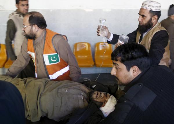 Rescue workers move a man who sustained injuries in a suicide attack at a government office, to Lady Reading Hospital in Peshawar, Pakistan, December 29, 2015. ReutersKhuram Parvez