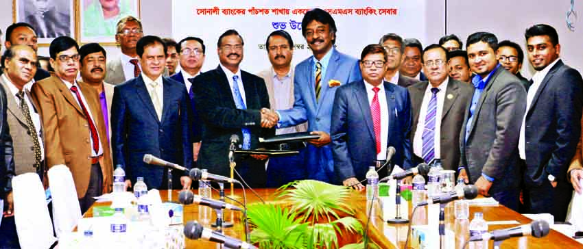 Pradip Kumar Datt, Managing Director of Sonali Bank Limited and Saiful Islam, Managing Director of SSL wireless, sign an agreement for SMS banking service for 502 branches at the bank's head office recently.