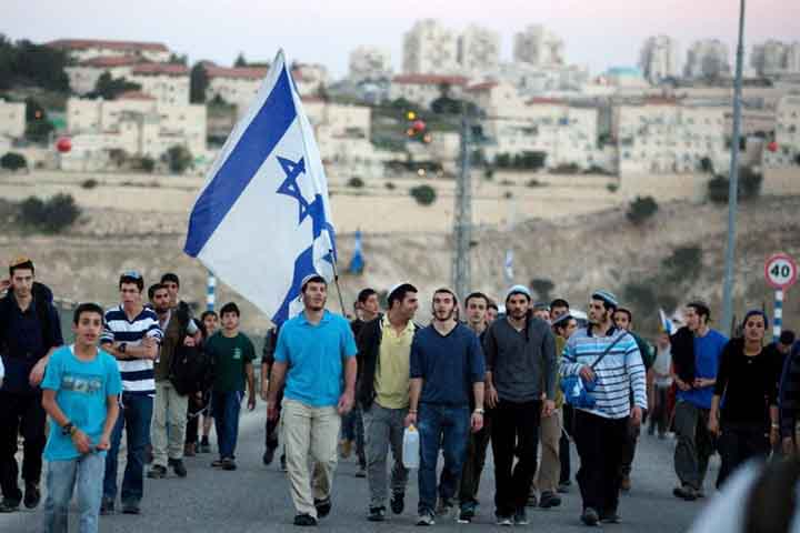 Right-wing Israelis march from the Jewish settlement of Maale Adumim to the controversial West Bank area known as E1, located east of Jerusalem and near the settlement