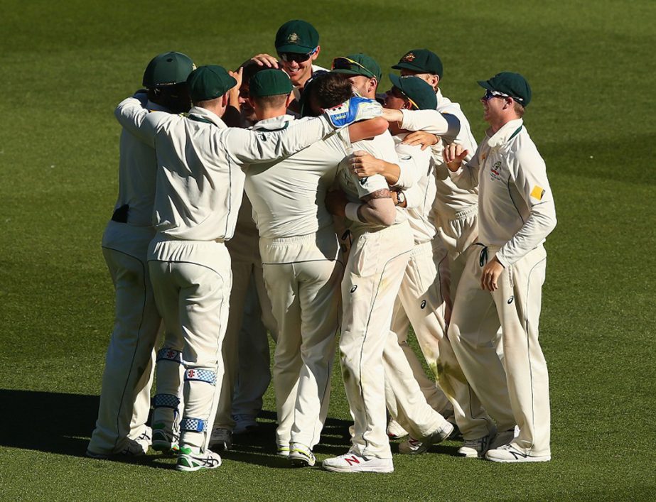Players of Australia celebrate after retaining the Frank Worrell Trophy against West Indies after 2nd Test in Melbourne on Tuesday.