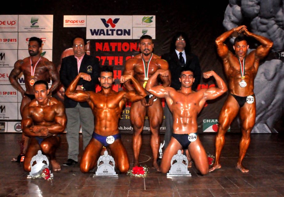 The winners of the Walton National Bodybuilding Competition with the guest and the official of Bangladesh Bodybuilding Federation pose for a photo session at the Auditorium of National Sports Council Tower on Tuesday.
