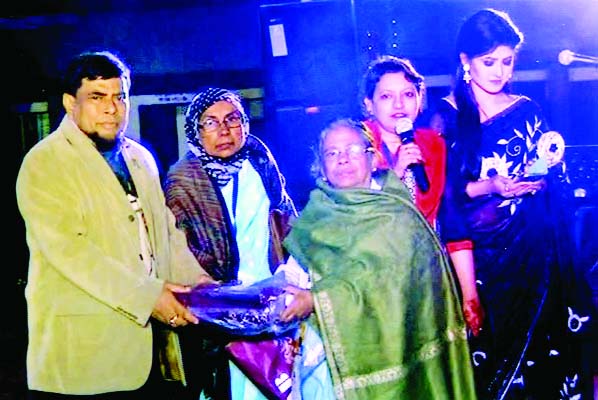 MOULVIBAZAR: Basana Davi, Convener, Founding Anniversary Committee of Nawab Ali Amzad Girls' School presenting crest to writer and columnist Sadek Ahmed at a function in the school premises recently.