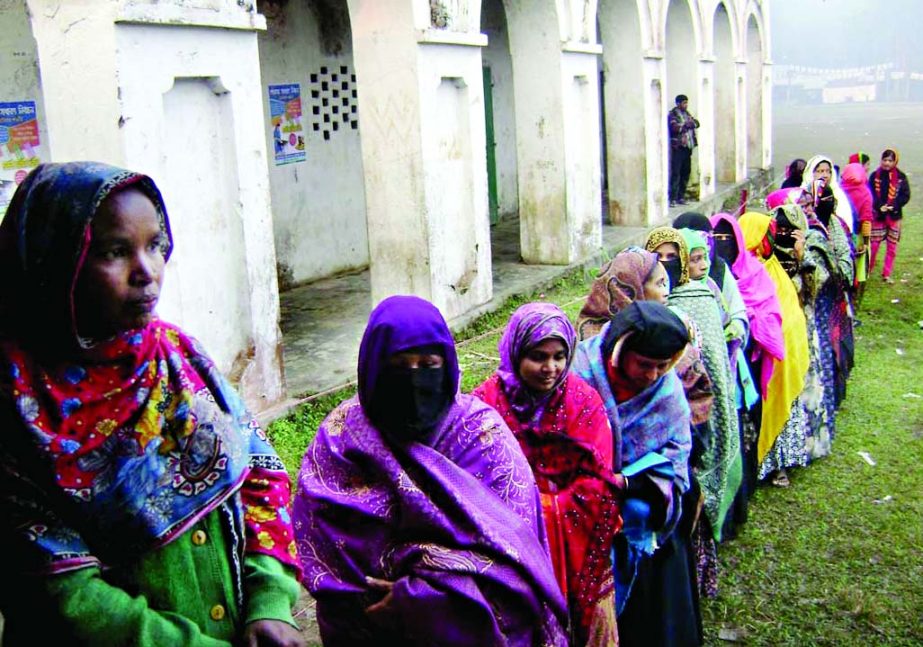 BARISAL: Women in long queue at a polling centre at Banaripara Union Pilot High School yesterday morning.