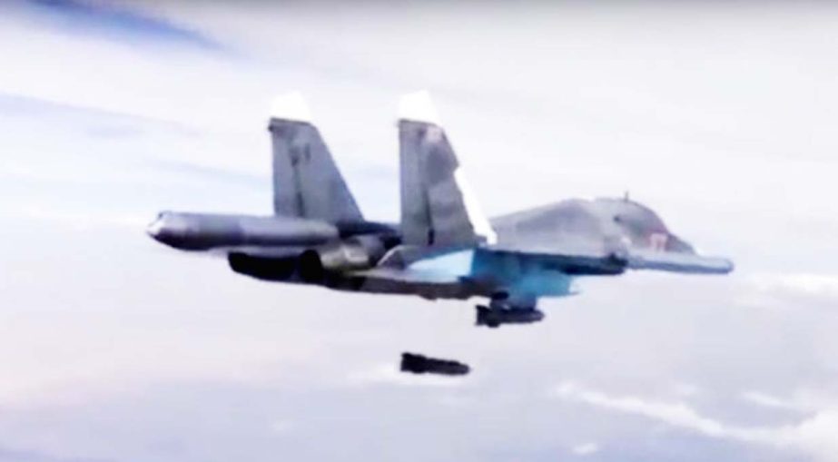 A Russian Su-34 bomber drops bombs on a target in Syria.