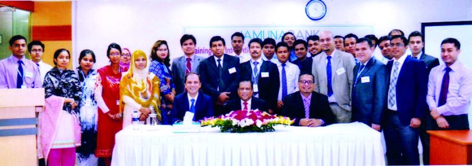 Shafiqul Alam, Managing Director of Jamuna Bank Ltd, poses with the trainers of a three-day long training progrmme on "International Trade & Foreign Exchange Operation" at its training academy in the city recently.