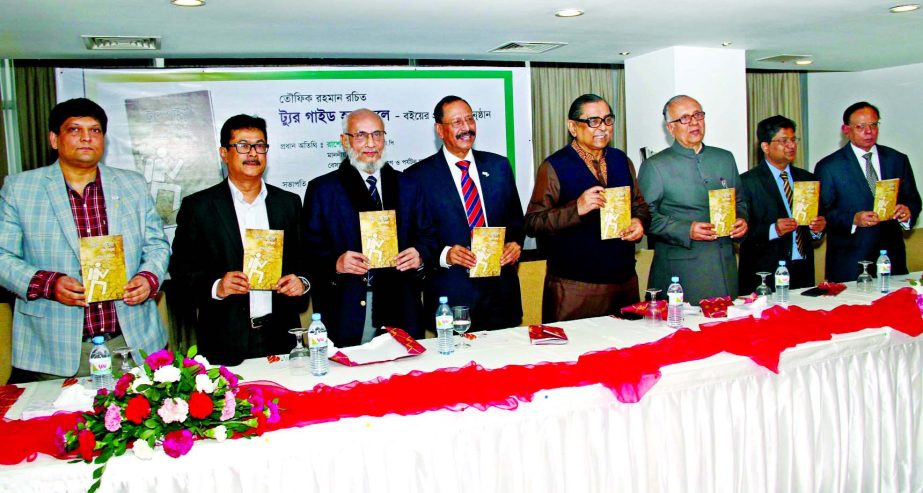 Civil Aviation and Tourism Minister Rashed Khan Menon, unveiling a book "Tour Operator Hotey Holey" at Dhaka Regency Hotel & Resort in the city recently. Taufiq Rahman- Secretary General of PATA BD Chapter, Akhtaruz Zaman Khan Kabir- CEO of Bangladesh T