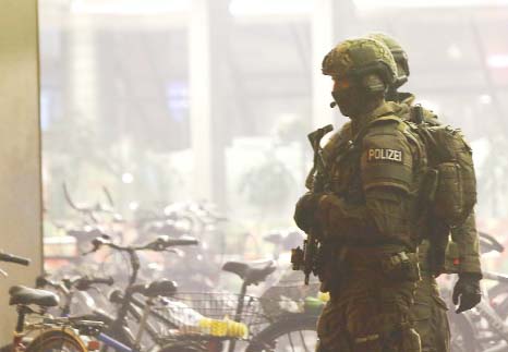 German police secure the main train station in Munich on Friday.