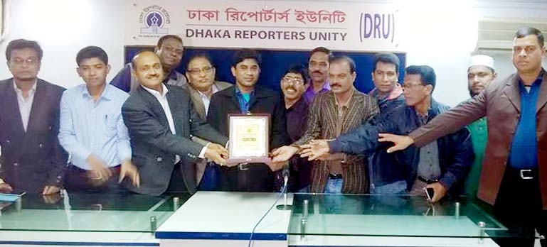 Leaders of CRU presenting citation to DRU leaders at a function recently.