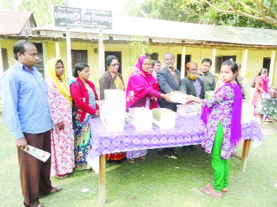 GAIBANDHA: Asma Hakkini , Headmistress of Kholahai High School in Gaibandha Sadar Upazila distributing text books at school compound on Friday.