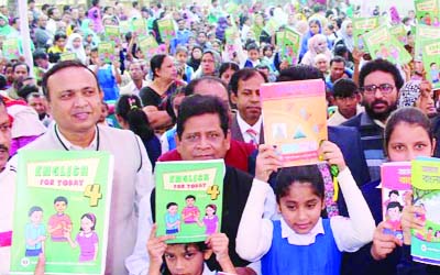 KISHOREGANJ :Students rejocing a happy event after getting free text books at Govt Adarsha Shishu School in Kishoreganj on Friday