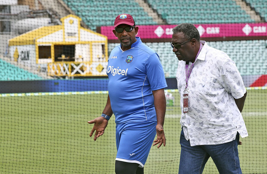 West Indies coach Phil Simmons (left) chats with former player Clive Lloyd before team training ahead of their Test match against Australia in Sydney on Saturday. The Test match begins today.
