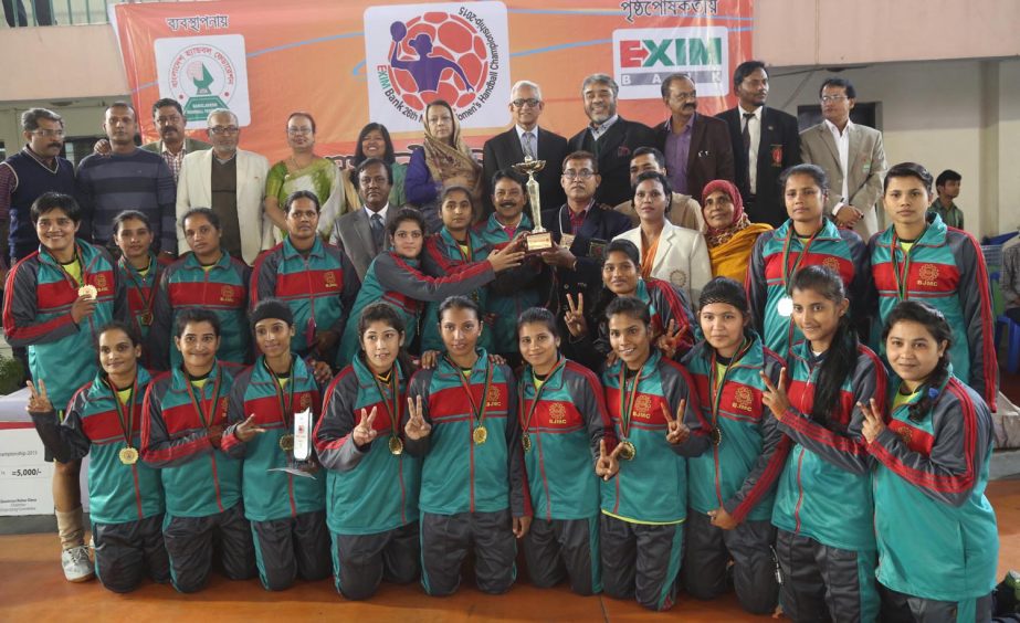 Members of BJMC, the champions of the EXIM Bank 26th National Women's Handball Competition with the guests and the officials of Bangladesh Handball Federation pose for a photo session at the Shaheed (Captain) M Mansur Ali National Handball Stadium on Sat