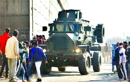 An Indian armored vehicle moves near an Indian air force base in Pathankot, 430 kilometers (267 miles) north of New Delhi. Gunmen attacked the air force base near the border with Pakistan early Saturday. Internet photo