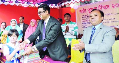 NARSINGDI: Abu Hena Morshed Zaman, DC, Narsingdi distributing new text books among the students of Narsingdi Govt Girls' High School on Friday.