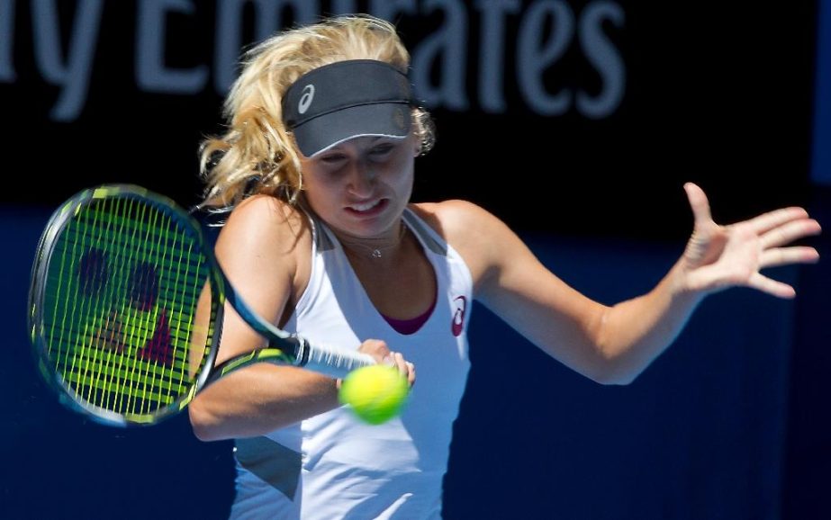 Daria Gavrilova of the Australia Green team hits a return against Sabine Lisicki of Germany during their first session women's singles match on day one of the Hopman Cup in Perth on Sunday.