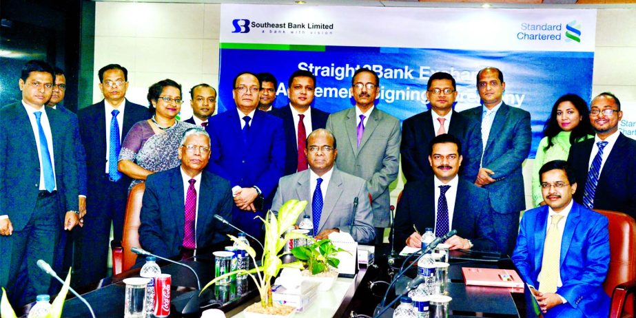 Abrar A Anwar, Chief Executive Officer of Standard Chartered Bank Bangladesh and Shahid Hossain, Managing Director of Southeast Bank Limited, sign an agreement at the Southeast Bank's head office. Under this agreement, southeast will avail global FX E-Co