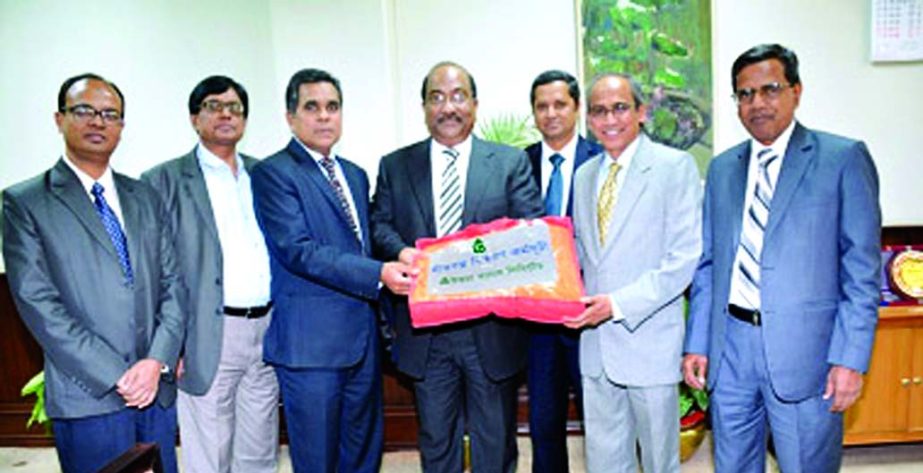 SK Sur Chowdhury, Deputy Governor of Bangladesh Bank receiving blankets from Shaikh Abdul Aziz, Managing Director of Uttara Bank Limited recently for the distressed cold-stricken people of the country in the city recently.