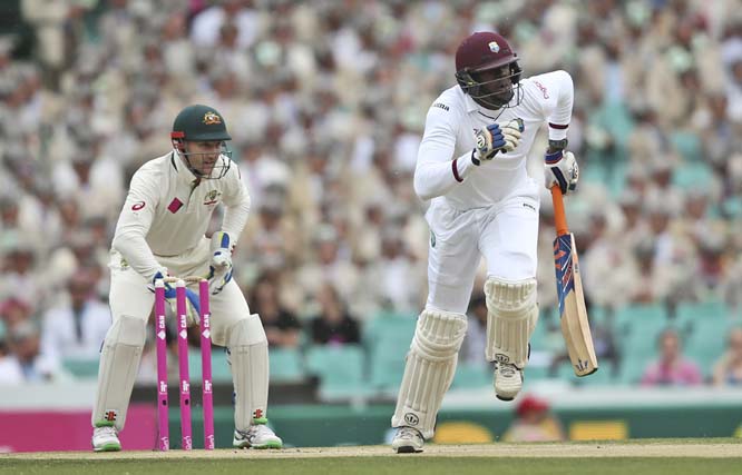 West Indies' batsman Carlos Brathwaite runs between the wicket during their cricket test match against Australia in Sydney, Australia on Monday.