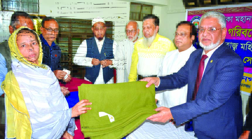 Alhaj Mohiuddin Ahmed Director of Shahjalal Islami Bank Ltd distributing blankets among winter hit and destitute people at Dhaka Mahanagar Samity premises in the city on Tuesday.