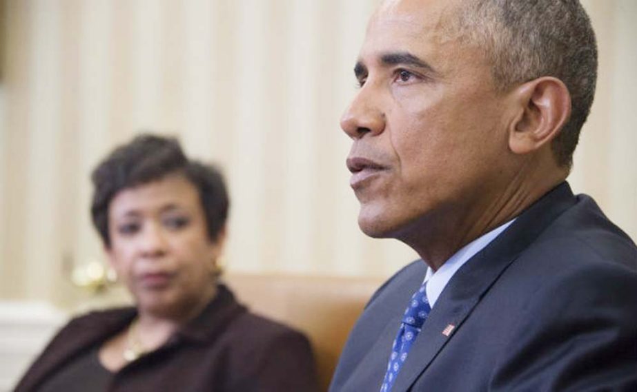 US President Barack Obama speaks with Attorney Genral Loretta Lynch in the Oval Office of the White House in Washington on Monday.