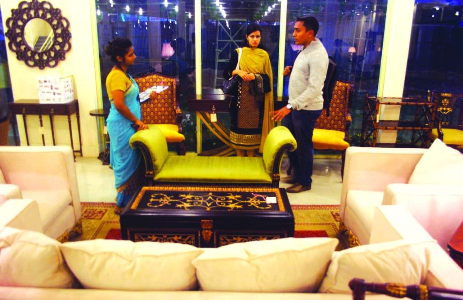 Customers visiting the pavilion of Legacy Furniture stall to select latest model furniture in Dhaka International Trade Fair 2016 at Bangabandhu International Conference Centre in the city on Wednesday.