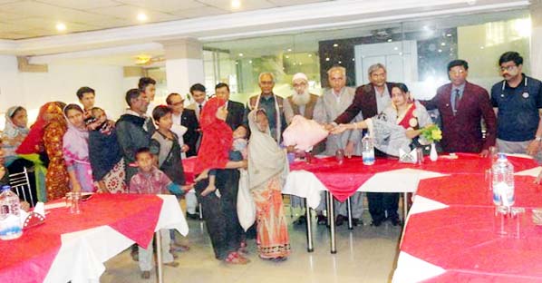 Chairman of World Peace Council Principal Dr.Abdul Karim accompanied by other office- bearers of the council distributing winter clothes to the hapless and poor at its city office premises on Saturday.