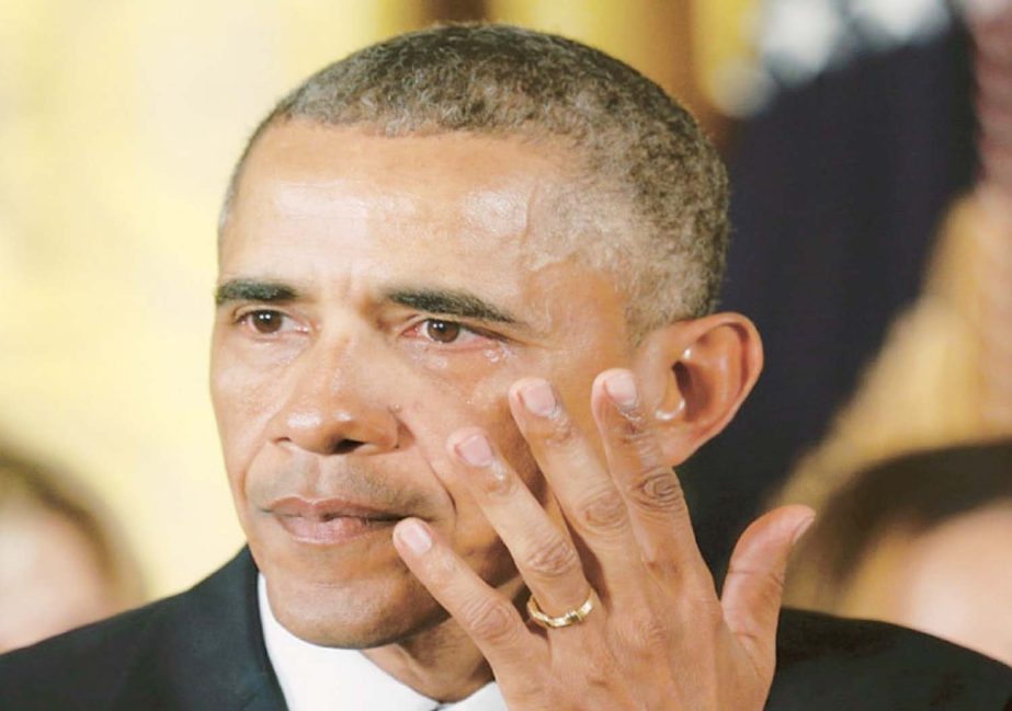 US President Barack Obama wipes away a tear while announcing steps the administration is taking to reduce gun violence while delivering a statement in the White House on Tuesday.