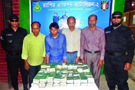 A team of Rapid Action Battalion (RAB) arrested four suspected human traffickers with 900 passports from cityâ€™s Banani area on Wednesday.