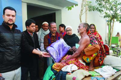 MYMENSINGH: Kamrul Islam Mohammad Waleed, Chairman, Mymensingh Sadar Upazila distributing allowance and books among poor people at Sadar Upazila auditorium recently. ANM Faizul Haque, UNO, Khaleda Atik, Vice Chairman of Upazilla Parishad and soci