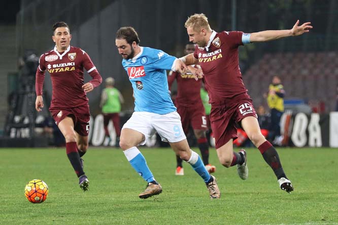 Napoli's Gonzalo Higuain (left) vies for the ball with Torino's Kamil Glik during the Italian Serie A soccer match between Napoli and Torino at the San Paolo stadium in Naples, Italy on Wednesday.