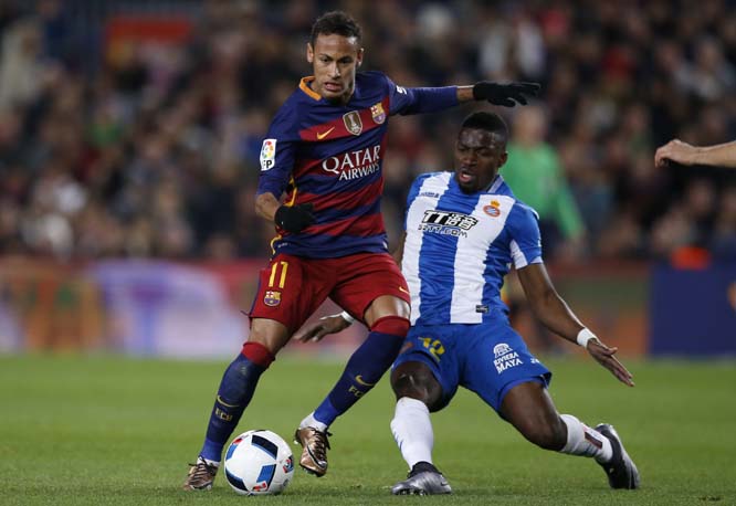 FC Barcelona's Neymar (left) duels for the ball with Espanyol's Pape Diop during a Copa del Rey soccer match at the Camp Nou stadium in Barcelona, Spain on Wednesday.