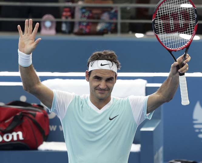 Roger Federer of Switzerland waves to the crowd after he won his semifinal match against Dominic Thiem of Austria during the Brisbane International tennis tournament in Brisbane, Australia on Saturday.