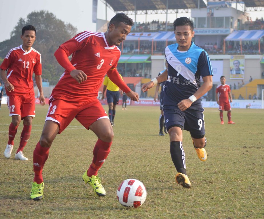 An action from the match of the 4th Bangabandhu Gold Cup International Football Tournament between Malaysia and Nepal at the Shams-Ul-Huda Stadium in Jessore on Saturday.